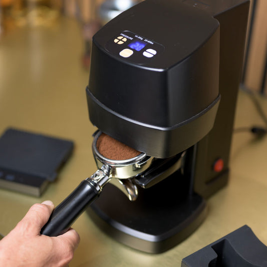 Black auto tamper with portafilter