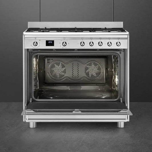 https://www.tafelberg.co.za/stores/za.co.storefront7.tafelberg/products/ssa91max2/pictures/smeg-90cm-stainless-steel-gas-electric-cooker-ssa91max2-open-empty_oqka.jpg