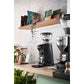 Black Mazzer Mini Compact espresso grinder on café bar