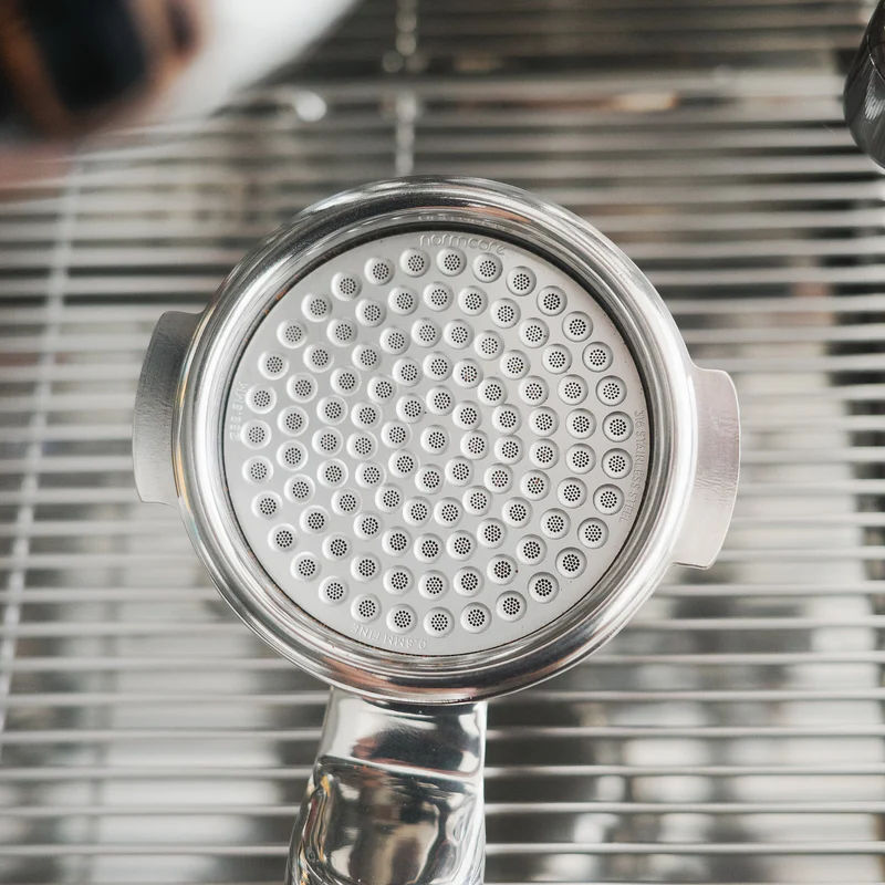 Normcore puck screen inside espresso machine portafilter