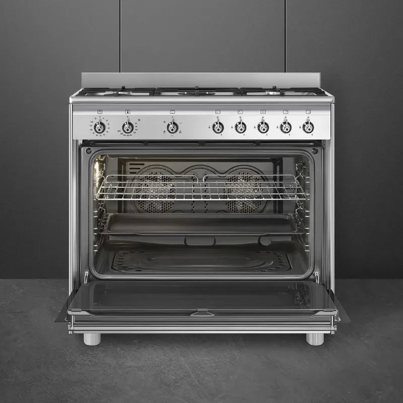 https://www.tafelberg.co.za/stores/za.co.storefront7.tafelberg/products/ssa91ggx2/pictures/smeg-90cm-stainless-steel-classica-gas-cooker-ssa91ggx2-open_6ygo.jpg